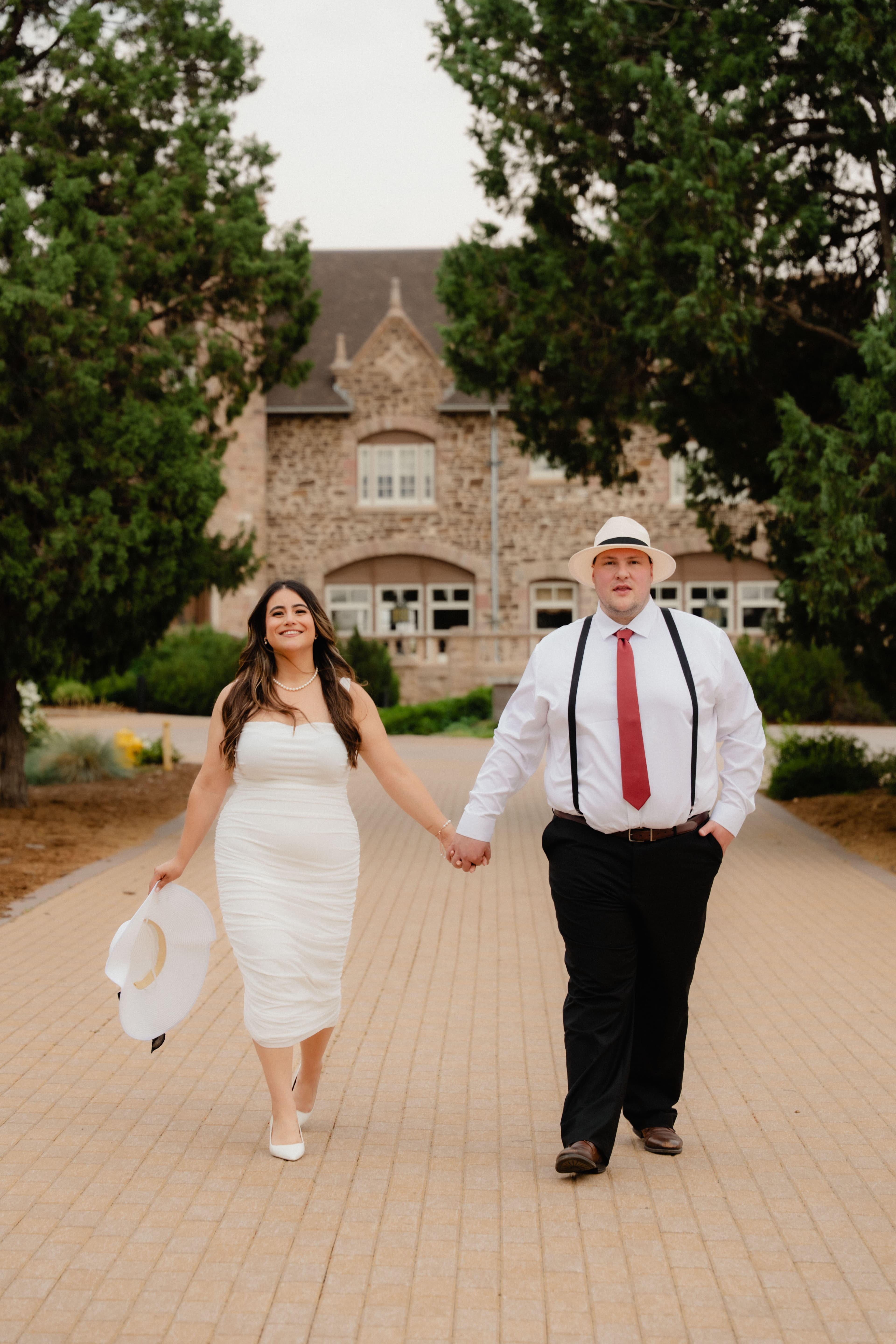 Raquel and Mark Anthony walking hand in hand